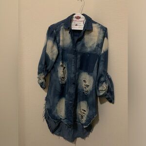 Women’s blue jeans ripped blouse.